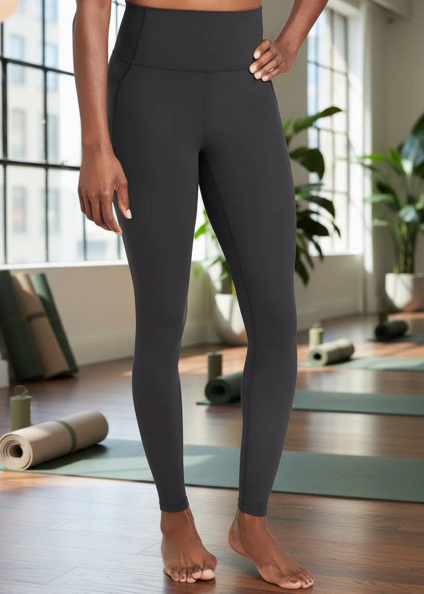 Person wearing black leggings on a white background