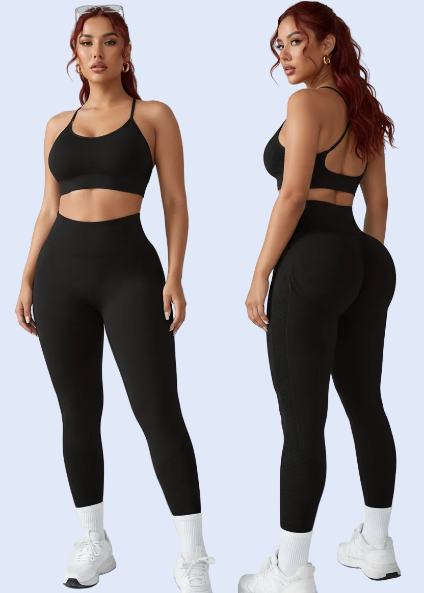 Person wearing a black athletic outfit on a white background