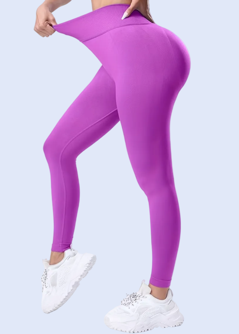 Purple leggings worn by a person on a white background