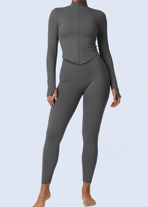 Person wearing a gray jumpsuit on a white background with product details at the bottom.