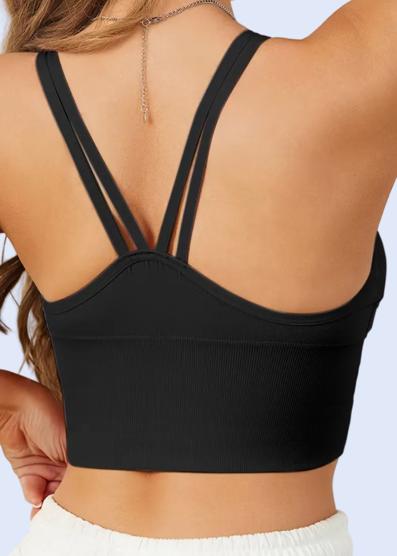 Black sports bra worn by a person with a neutral background
