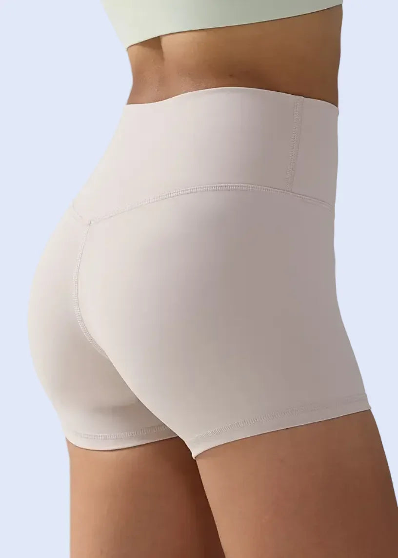 White shapewear being worn on a person against a gray background with 'Add to cart' button visible.