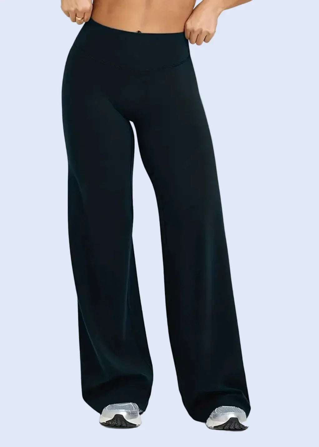 Woman wearing black high-waisted wide-leg activewear pants from GymDeity
