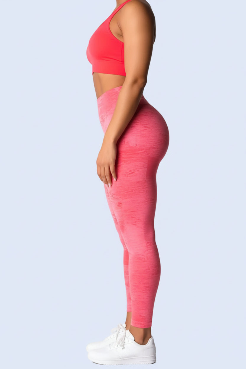 Person wearing a pink athletic outfit on a white background