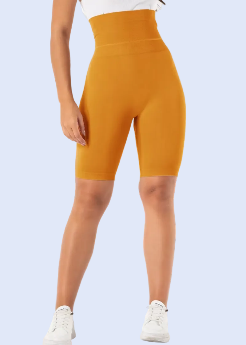 Person wearing bright yellow leggings in a modern living room.