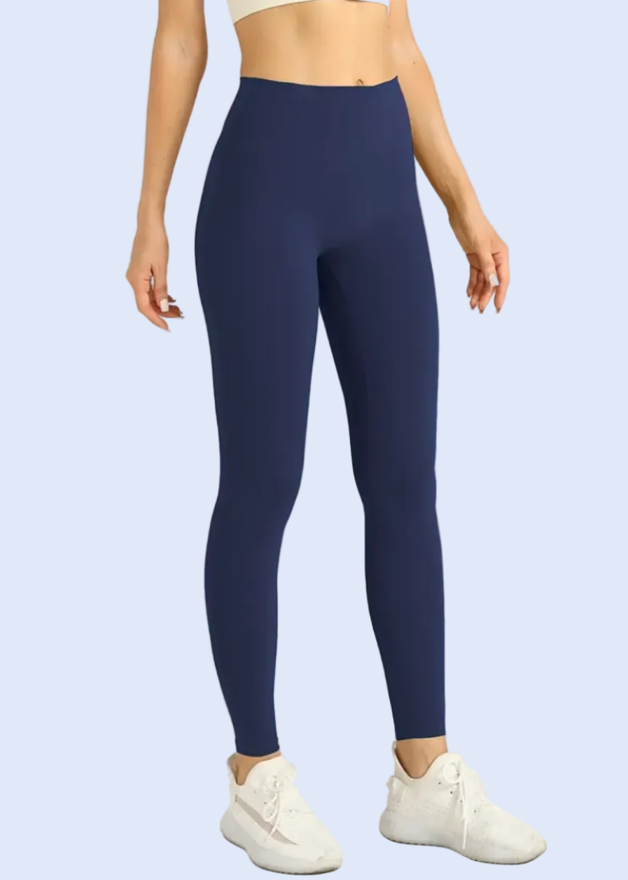 Navy blue leggings worn by a person on a white background