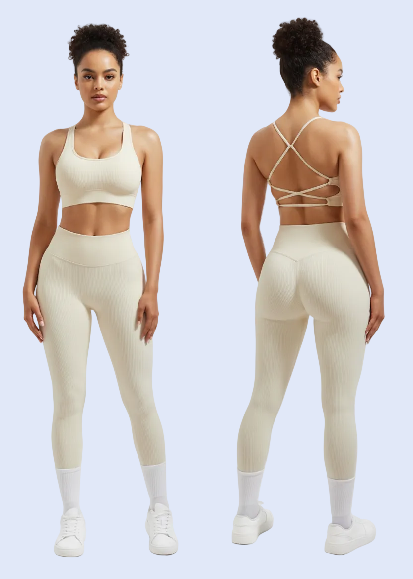 Person wearing a beige strappy top and leggings on a white background