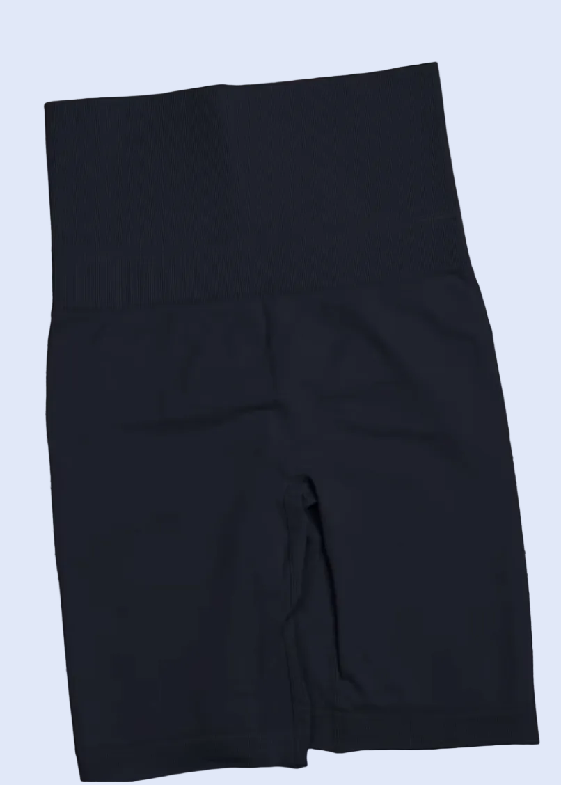 Black high-waisted leggings on a magazine with a shopping cart icon at the bottom.