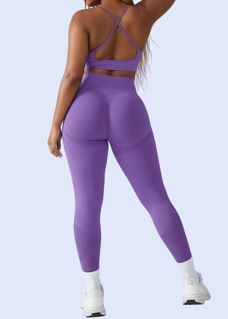 Person wearing a purple athletic outfit on a white background
