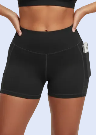 Black athletic shorts worn by a person on a light gray background