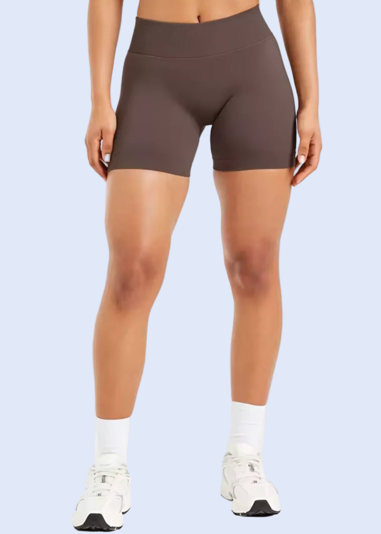 Person wearing brown athletic shorts on a white background with 'Add to cart' button visible.