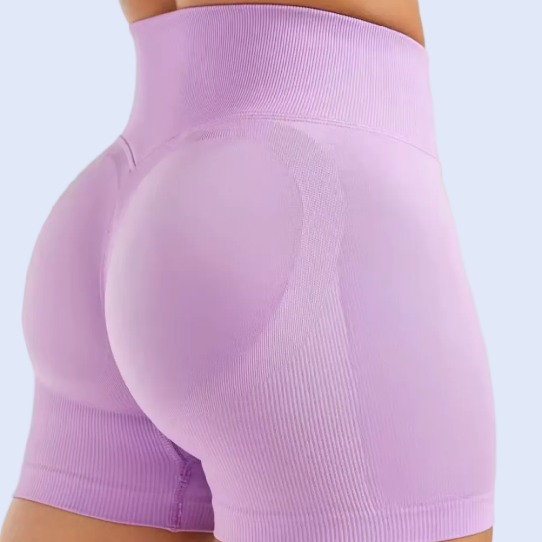 Purple athletic shorts on a white background