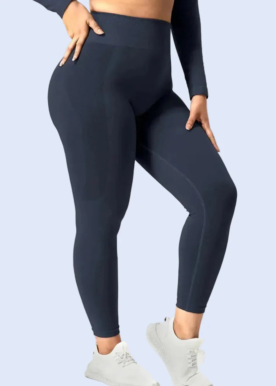 Woman wearing navy high-waisted seamless gym leggings from ActivewearBox, GymDeity