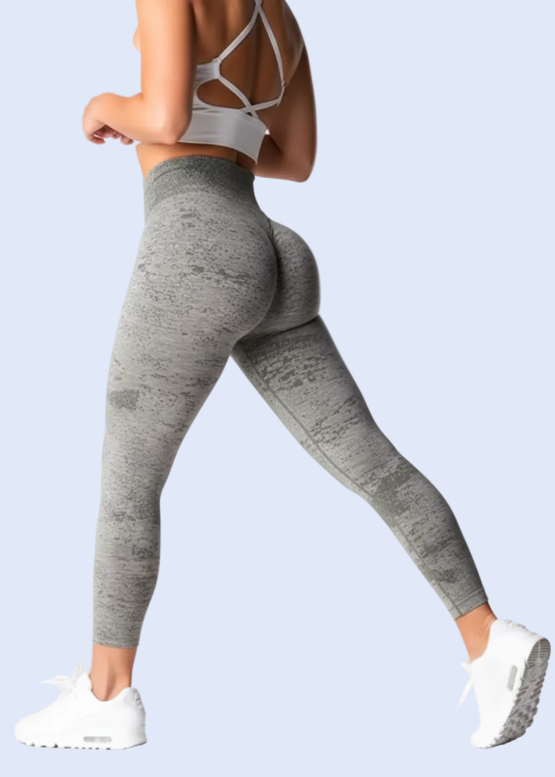 Person wearing gray leggings on a white background with product details at the bottom.