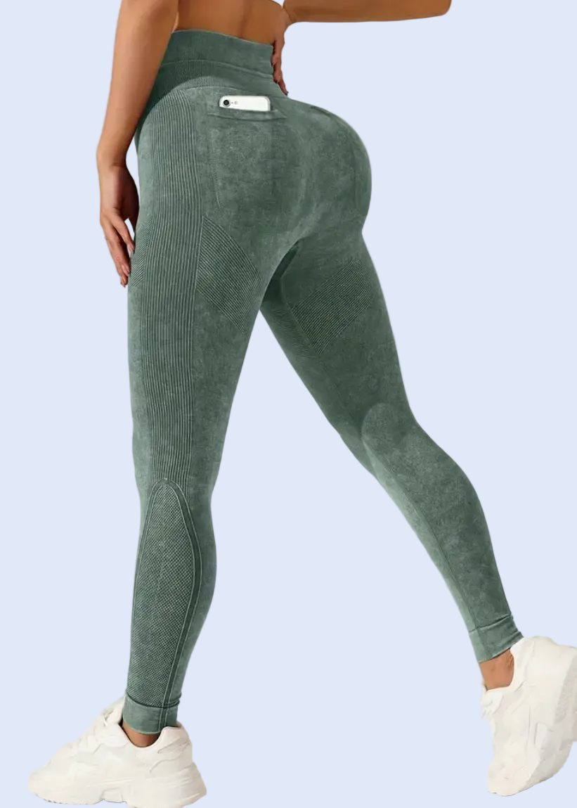 Green leggings worn by a person on a plain background