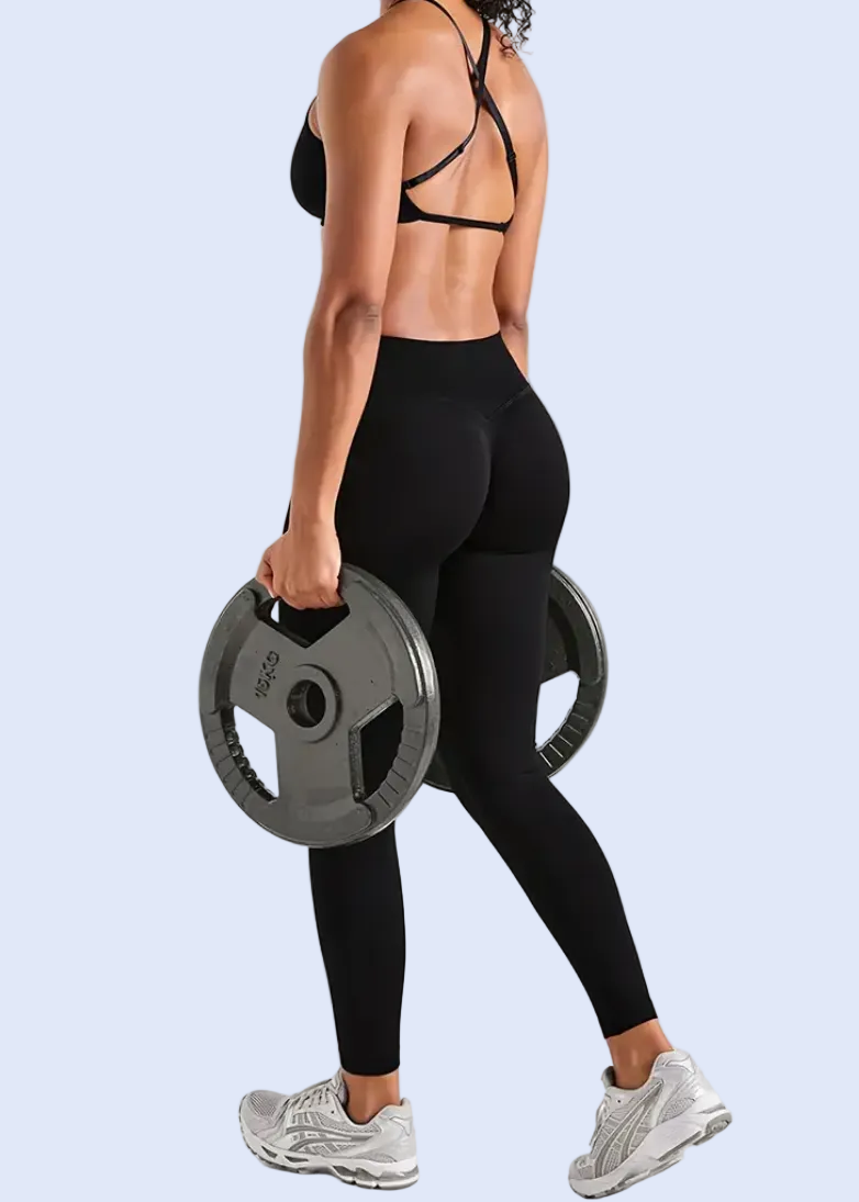 Person holding a weight plate on a white background