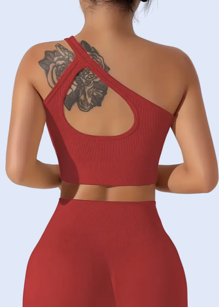 Red dress with cut-out back design on a plain background