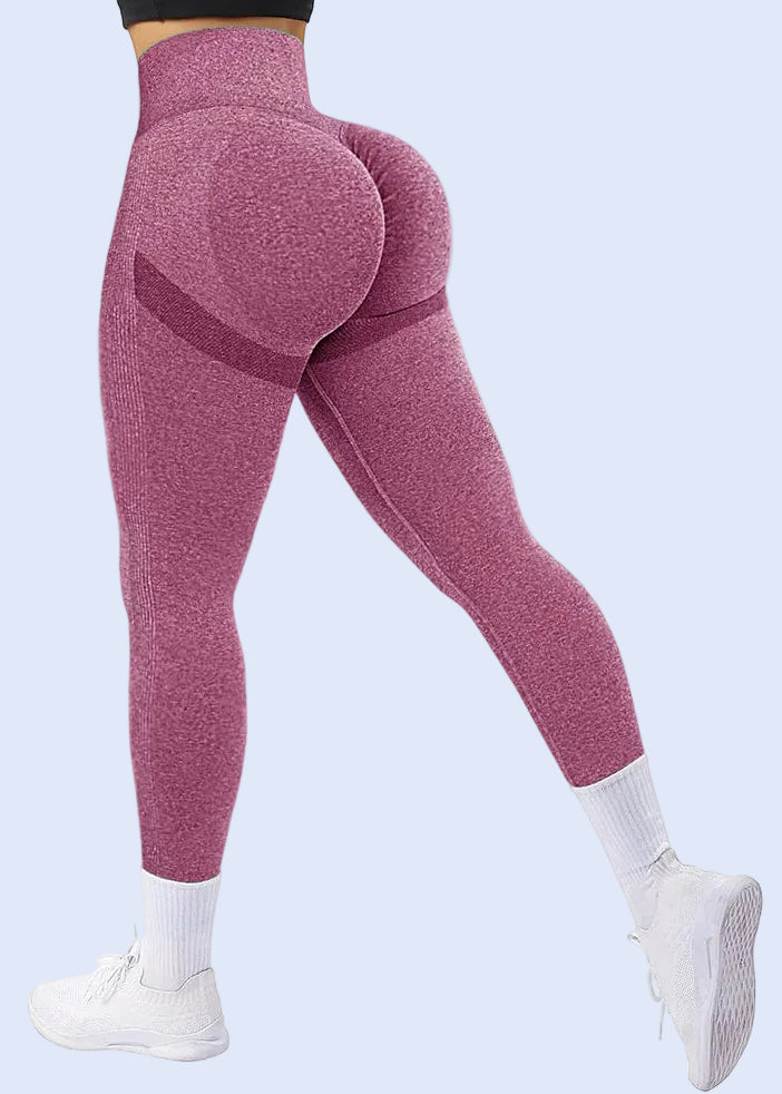 Pink leggings worn by a person on a white background