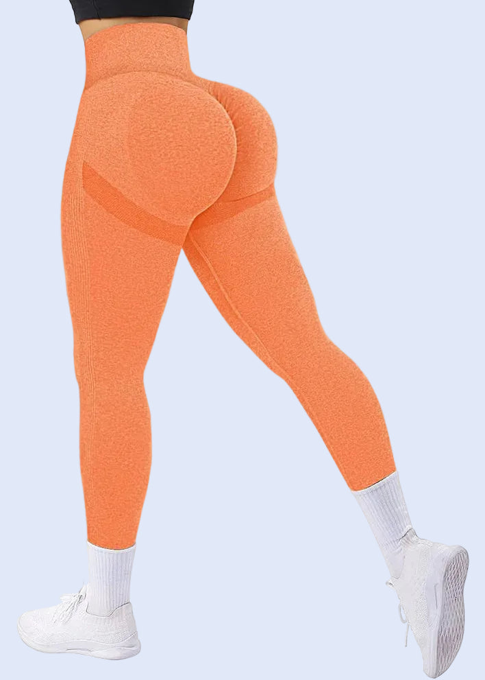 Orange leggings worn by a person on a white background