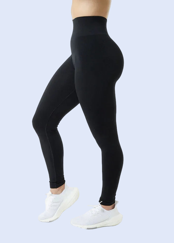Black leggings worn by a person on a white background