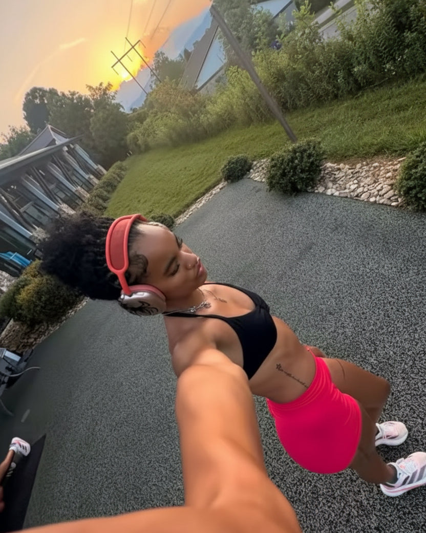 Person taking a selfie outdoors with a scenic background