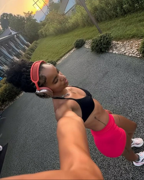 Person taking a selfie outdoors with a scenic background