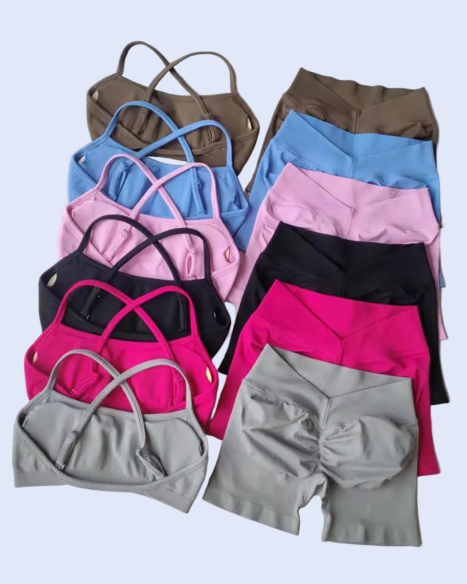 Collection of colorful women's athletic wear on a light gray background