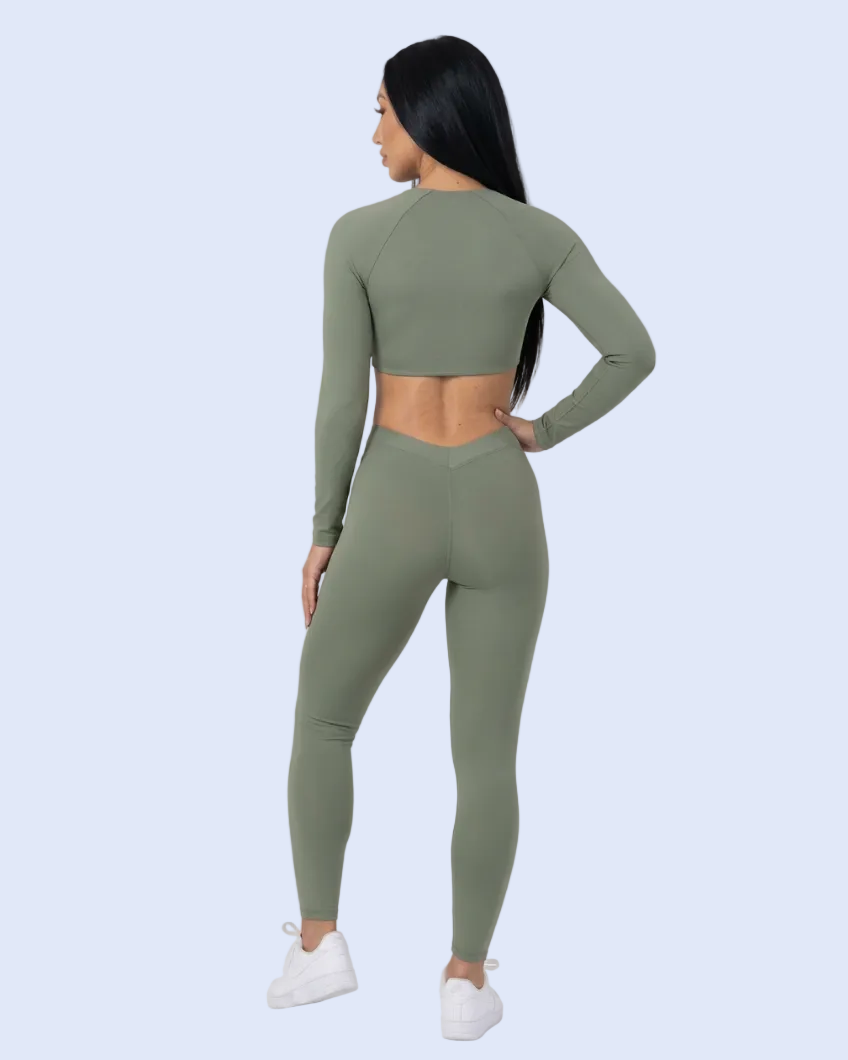 Back-view hip-pop pose in the olive outfit
