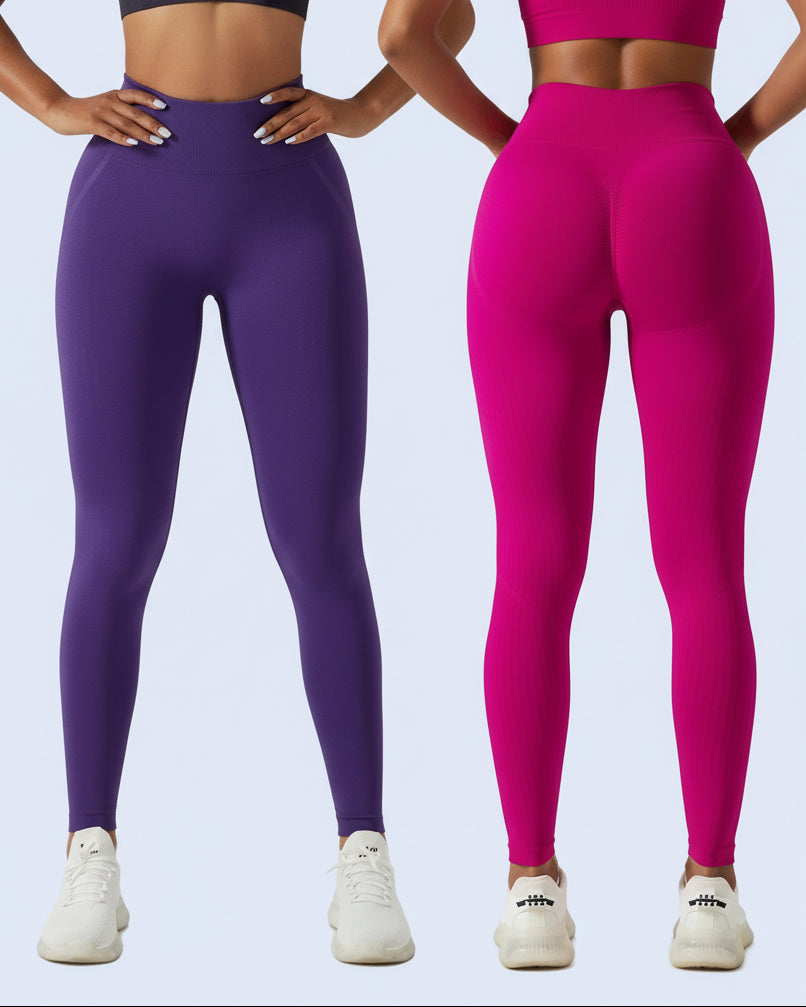 Two pairs of leggings, one purple and one pink, on a plain background.