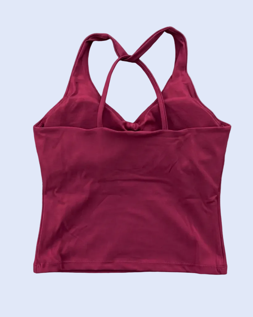 Burgundy tank top back-view flat lay, preserving the original strap design and stone background
