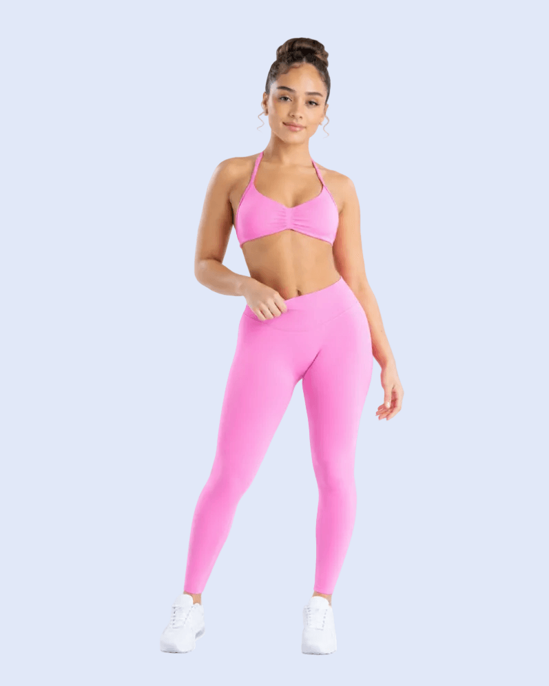 A model is shown in a six-panel collage wearing a bright pink sports bra and matching high-waisted leggings set against a light gray studio background.