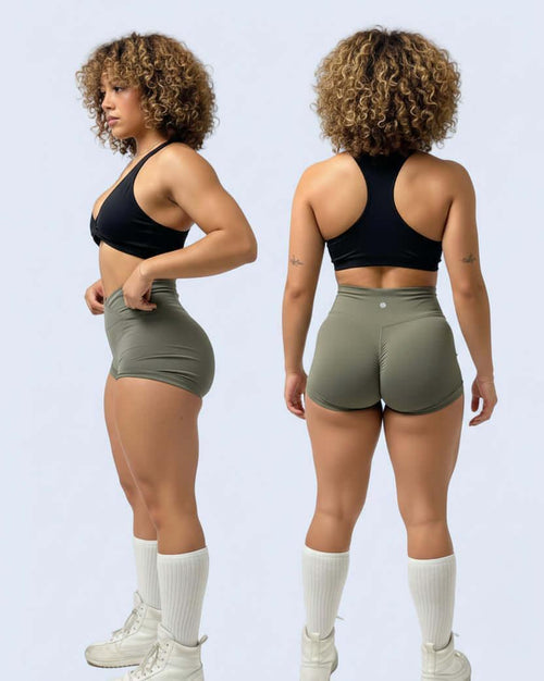 Person wearing a black sports bra and green shorts from front and back views on a light gray background