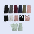 Collection of various leggings and sports bras on a light blue background