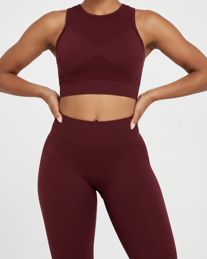 Maroon leggings worn by a person on a white background