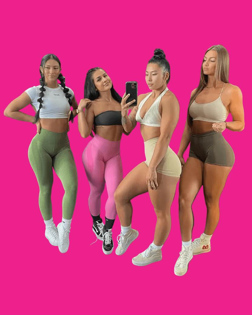 Four women posing in athletic wear against a pink background
